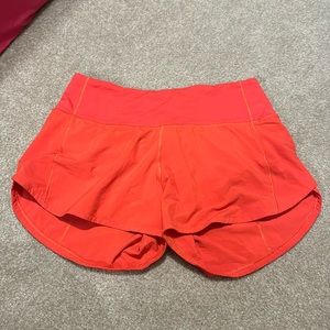 Lululemon speed up shorts size 4 coralish red/orange color